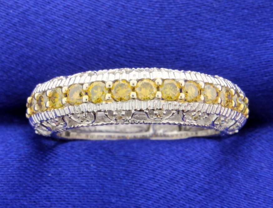 1.05 Carat Yellow Diamond Ring: Beautiful 1.05 carat Yellow diamond vintage style ring sent in 14k white gold in a 6mm band. The clarity of the diamonds is SI to VS and color is fancy golden yellow! Great ring at a real great value.