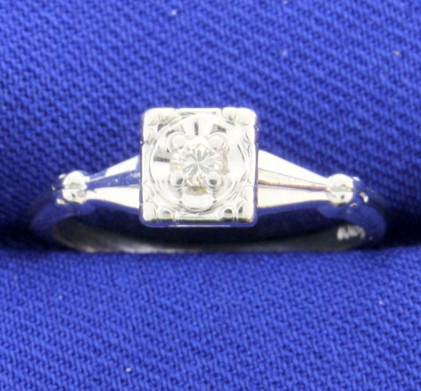 Vintage Diamond Ring: Lovely Vintage Diamond Ring set in 14k white gold with a brilliant cut diamond, 0.07 carats, set in an illusion head to make it appear bigger. This ring is in very nice condition. Size 5 1/2 2g