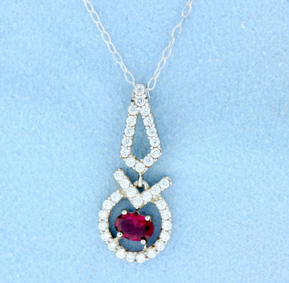 Sterling silver pendant and chain w/lab created Ruby: Beautiful sterling silver pendant with gorgeous oval Ruby center and accented with beautiful white stones 2.4g