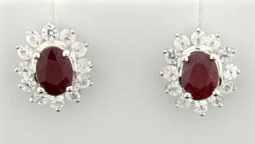 Genuine Ruby earrings: Fantastic sterling silver drop style stud earrings with genuine oval cut Ruby centers accented with white sapphires gemstones. Perfect for everyday wear or special occasions! 3.0g