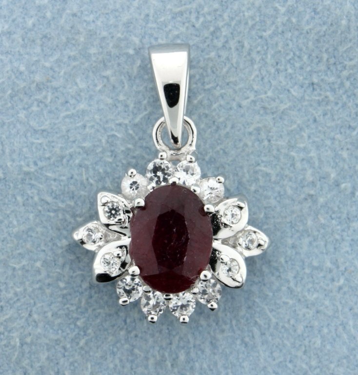 Genuine Ruby pendant with sterling silver chain: Lovely sterling silver pendant and sterling silver chain with gorgeous 4 carat oval cut genuine Ruby gemstone accented with white sapphires 3.2g