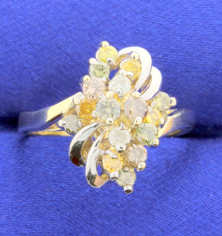 Diamond multi color ring: This is a gorgeous multi colored diamond ring set in 14k yellow gold. There are 14 diamonds in yellow, orange, white, green, and chocolate colors. They weigh a total of 0.70 carats with a SI-I 1 clari