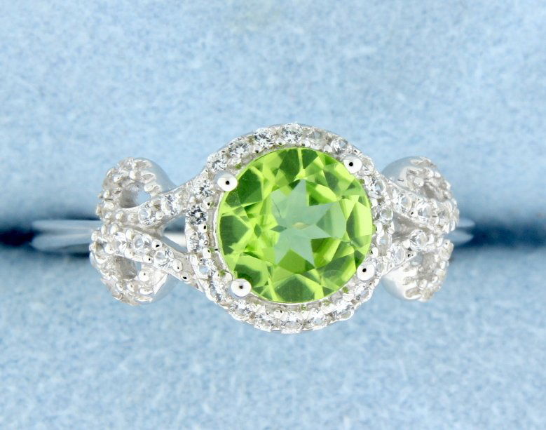 Peridot and white sapphire ring: Gorgeous sterling silver ring with beautiful 2 carat checkerboard cut round genuine Peridot gemstone set in a vintage style setting decorated in white sapphires. Size 8 2.7g