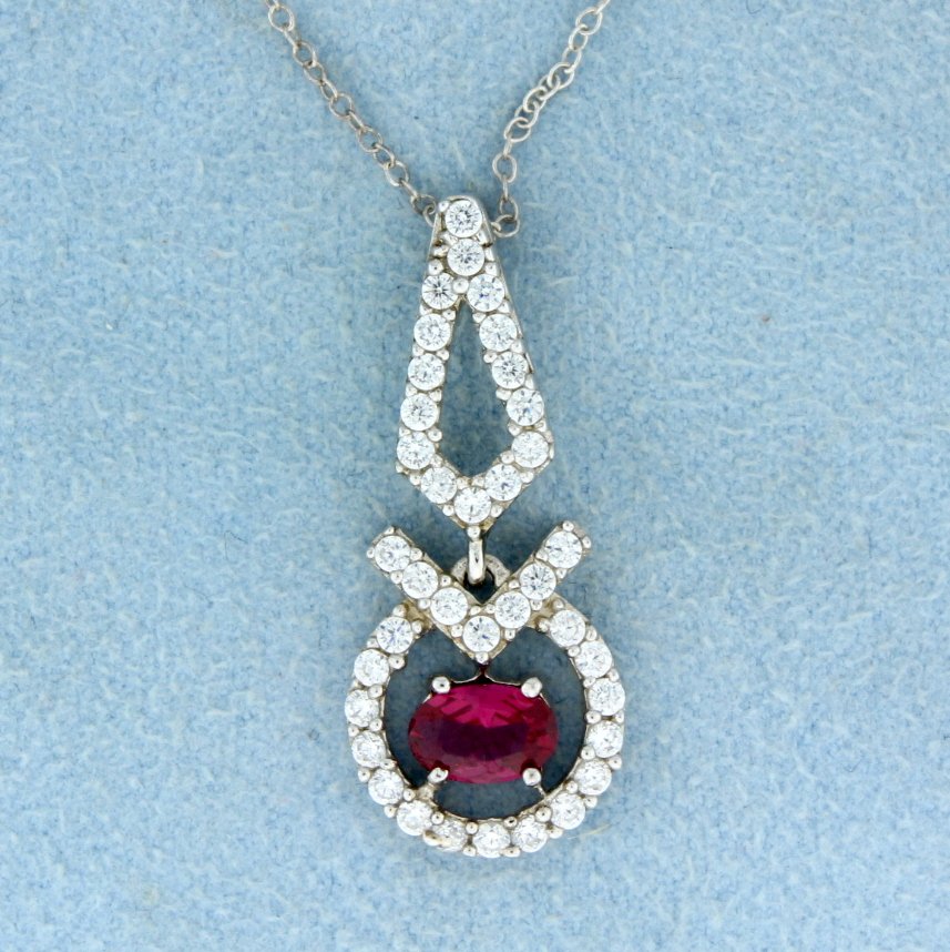 Lab Ruby pendant set in sterling silver: Beautiful sterling silver pendant with gorgeous oval lab Ruby center accented with beautiful white sapphires 2.4g