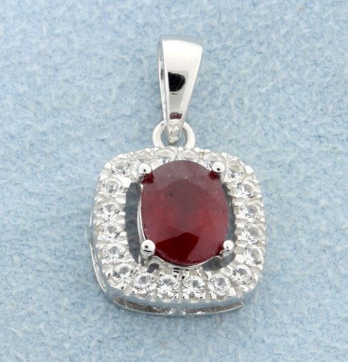 Genuine Ruby pendant with sterling silver chain: Beautiful and classic sterling silver pendant in gorgeous halo style with genuine oval Ruby gemstone at the center accented all around with sparkling white sapphires in cushion like shape and sterling