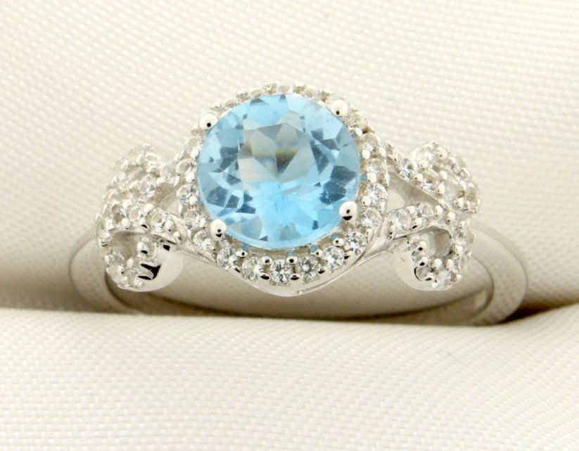 Checkerboard cut genuine Sky Blue Topaz ring: Gorgeous sterling silver ring with beautiful 2 carat checkerboard cut round genuine Sky Blue Topaz gemstone set in a vintage style setting decorated in white sapphires. Size 8 2.6g