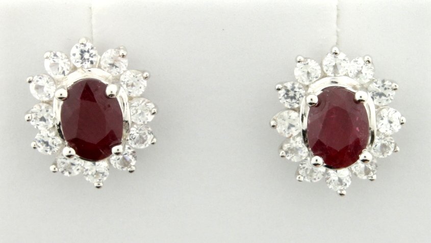 Genuine Ruby earrings: Fantastic sterling silver drop style stud earrings with genuine oval cut Ruby centers accented with white sapphires gemstones. Perfect for everyday wear or special occasions! 3.0g