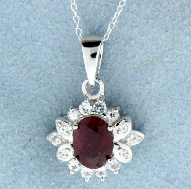 Genuine Ruby pendant with sterling silver chain: Lovely sterling silver pendant and sterling silver chain with gorgeous 4 carat oval cut genuine Ruby gemstone accented with white sapphires 3.2g