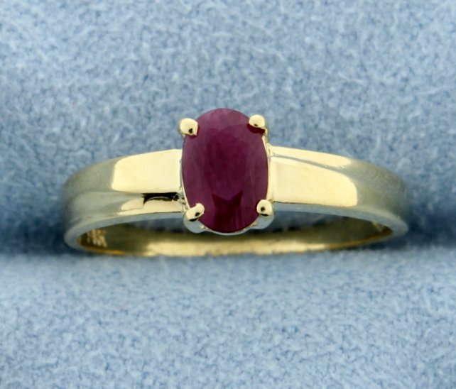 Ruby solitaire: This lovely 14k yellow gold ring offers a beautiful oval cut, gem AA quality, Ruby gemstone center. The Ruby is very red, measures 6mm x 4mm, approximately a 1/2. Size 5 1.6g