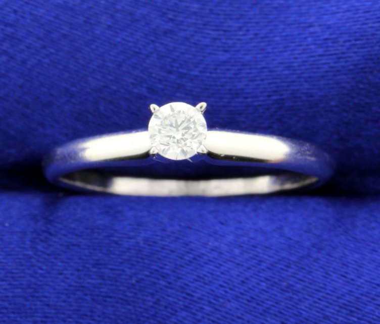 Diamond Solitaire: Stunning 14k white gold solitaire ring. The diamond is a classic 0.25 carat round solitaire, SI1 clarity and G color. Simple and elegant! 2.0g