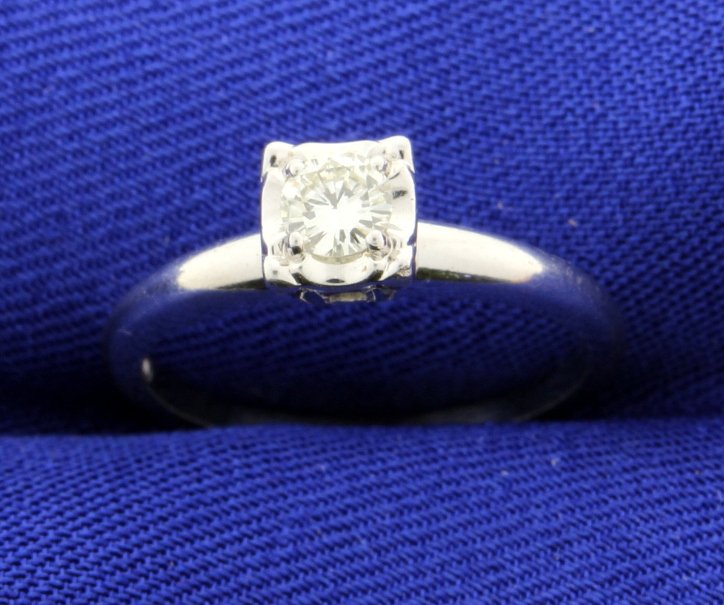Vintage Diamond Ring: This stunning vintage diamond ring is set in 14k white gold. The diamond is a 1/4 carat brilliant cut with VS-2 clarity and H color! This old traditional vintage diamond ring is spectacular! Size 6 1/