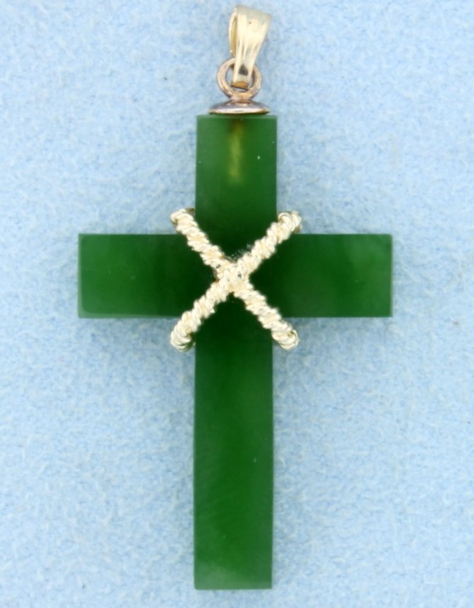 Jade and gold cross: This beautiful Nephrite Jade cross measures 1 1/2" tall and 3/4" wide and is accented with 14k yellow gold. Can be worn with chain up to 1 1/2mm. NO CHAIN 2.5g