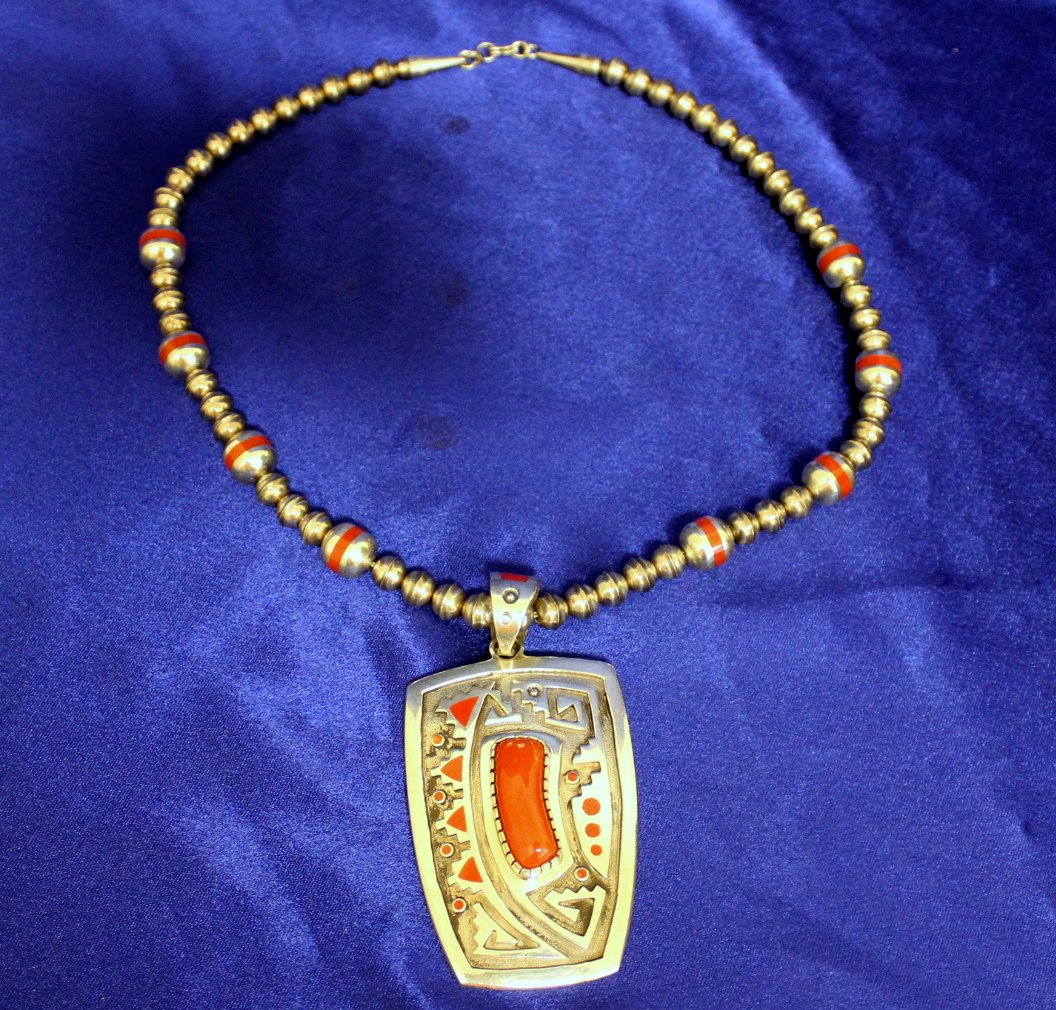 Navajo Native American Coral Necklace: Gorgeous Navajo Native American large Coral stamped sterling silver necklace with pendant, 3 1/2" x 2". The chain is sterling beads, 22" long. The balls on the necklace are 11.75mm large and the small
