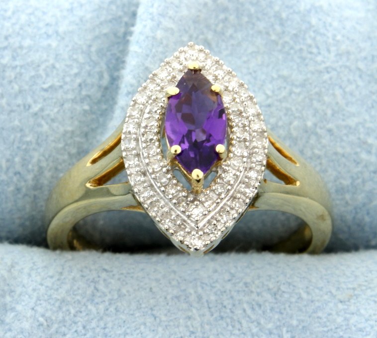 Marquise Amethyst Ring with Diamonds in 14K Yellow Gold: Elegant 8x4mm genuine Amethyst marquise center stone surrounded by .15ctw diamonds, SI clarity, H-I color. Ring weighs 4.1 grams total weight. Electronically tested gold, gemstones and diamonds.