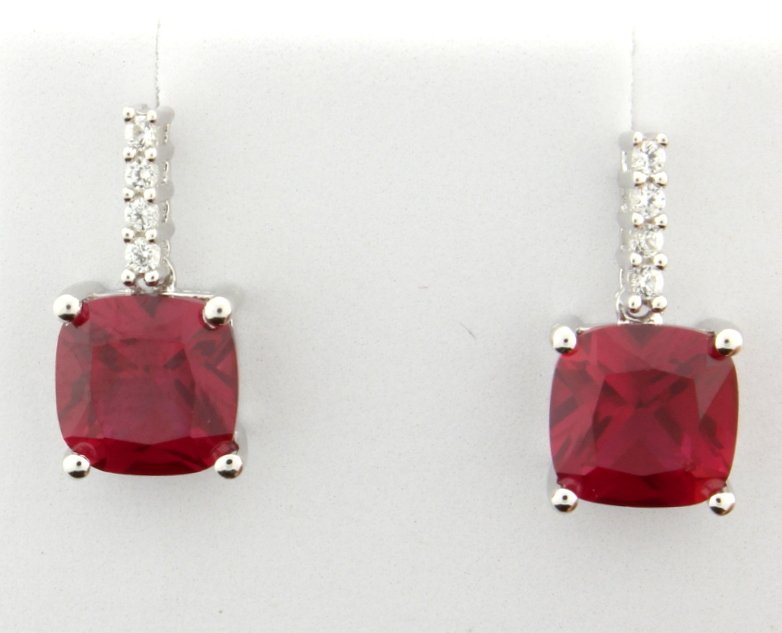 Sterling silver earrings with Lab Ruby: Fabulous sterling silver earrings with gorgeous cushion cut lab Ruby gemstones that dangle from white sapphire covered shanks. 3.1g
