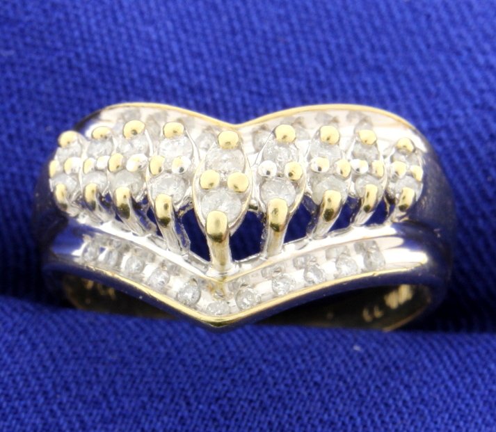 1/2 carat Diamond Ring: This lovely 1/2 carat Diamond Ring is set in 10k yellow gold. The shape of this ring is ideal for a middle or pointer finger. Size 10 1/2 6.8g