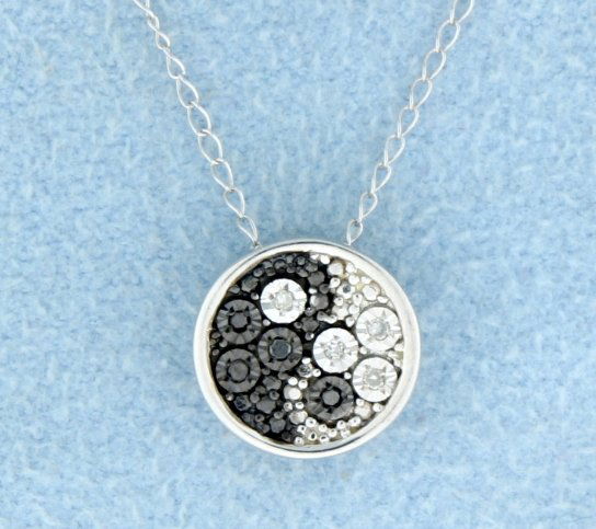 Ying and Yang Black and White Diamond Pendant: Beautiful Ying and Yang style pendant with sparkling black and white diamonds all set in sterling silver with sterling silver chain. 1.2g