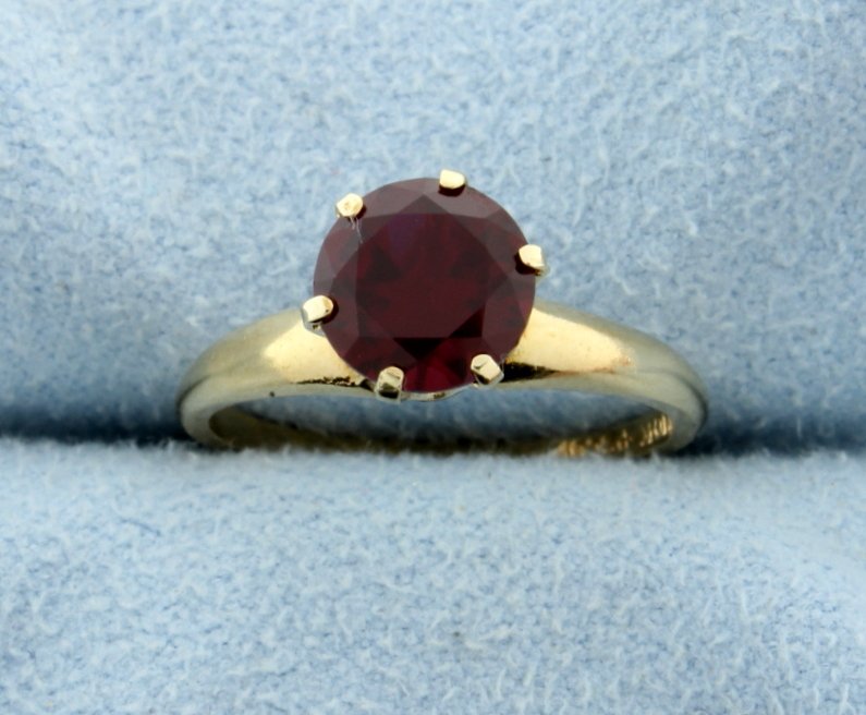 Vintage Lab Ruby Solitaire Ring: This great round lab created Ruby is 7.11 mm in diameter and is mounted in a beautiful vintage 10k yellow gold ring. Size 5 1/2 1.7g