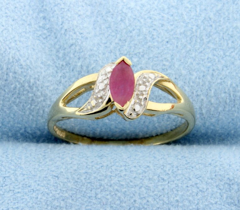 Ruby 10k Yellow Gold Ring: The ruby weighs approx. 0.30 ct. Size 7. 1.8g