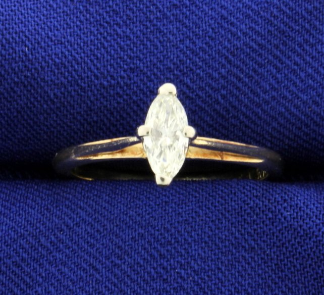 Diamond 0.42 carat 14k Solitaire Ring: The center is a marquise shape and 0.42 ct, SI2 clarity, and J color. Size 6.5. 2.0g