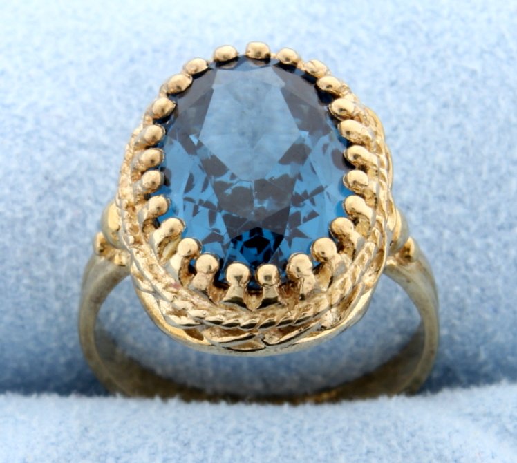 Vintage Blue Zircon Ring: Fantastic Vintage 10k yellow gold ring with huge stunning oval cut Blue Zircon gemstone--December birthstone. The lab created oval cut Blue Zircon is lab created is 5/8" long and 3/8" wide. Size 6 5.0