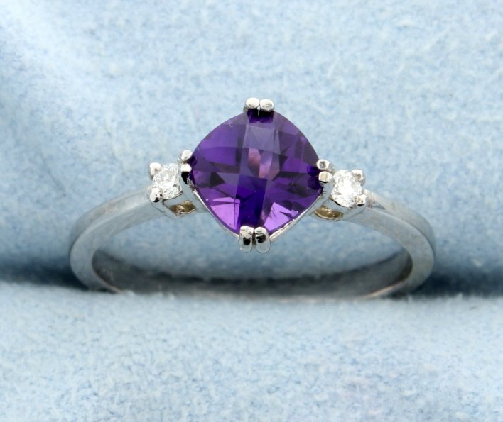 Amethyst & Diamond Ring: Lovely AAA quality 0.85 carats cushion cut Amethyst with accent diamonds set in a beautiful 14k white gold ring mounting. The Amethyst has a checkerboard cut top. The diamonds are brilliant cut VS cla