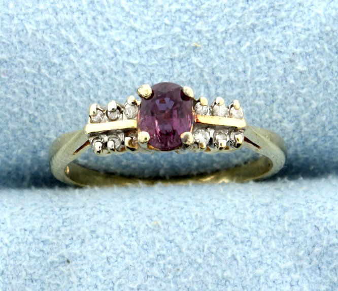 Ruby & Diamond Ring: This lovely 10k yellow gold ring sparkles with a beautiful oval center gem quality Ruby, 5mm x 3mm. The diamonds total 0.15 carats. Size 5 3/4 1.8g