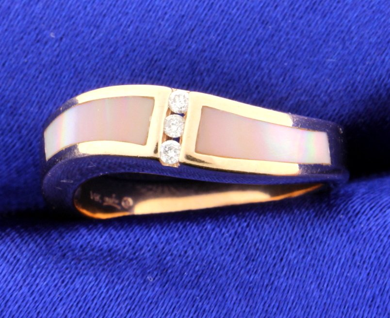 Mother of Pearl Inlay and Diamond ring: Pretty Mother of Pearl Inland and diamond ring set in 14k rose gold. There are 3 diamonds that weigh a total of 0.05 carats and are VS clarity and G color. The ring is in almost perfect condition. The
