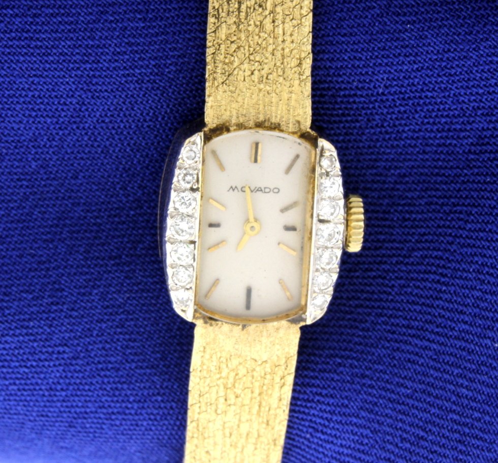 Vintage Movado Diamond Watch: This magnificent Vintage Movado Ladies Diamond watch is set in 14k yellow gold. The watch is 6 3/4" long and there are 14 single cut gem diamonds. The total diamond weight is 0.30 carats, VS clarity a