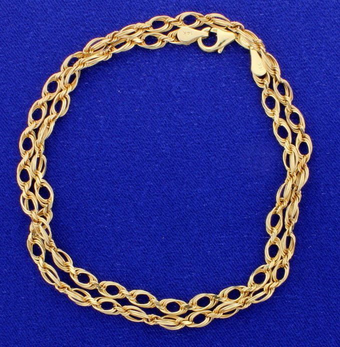 18" 14k Fashion Chain: See photos for style. This chain is well made and has lobster clasp and 14k stamped plaques. 3/16" wide. 11.6g