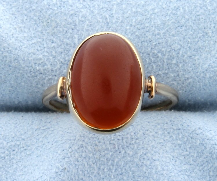 Carnelian cabochon ring: 14k yellow gold. Cabochon is 13mmx10.5mm. Size 7. 2.2g