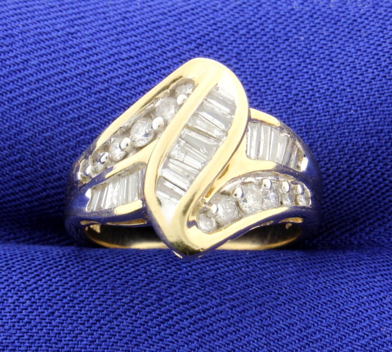 1 carat Diamond Ring: Fantastic 14k yellow gold ring with 1 carats of round brilliant cut and baguettes that total 1 carat of fine diamonds! The clarity are SI to I-1 and G-H-I colors. This ring has a big diamond look! Siz