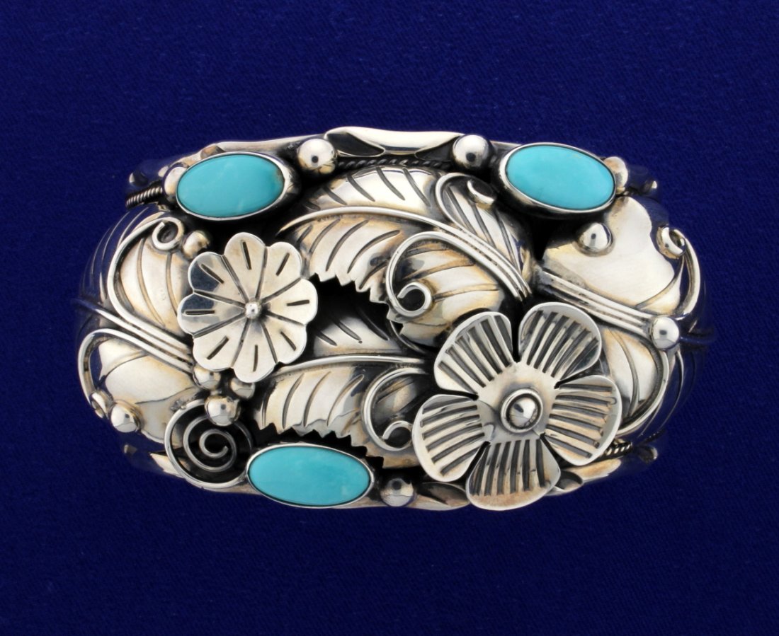 Sterling Cuff with Turquoise: Cuff is stamped .925 C11. Turquoise stones. This has fantastic craftsmanship. 1-3/4" wide at the top. Not sure if the cuff is Navajo. Size 2.2". 74.1g