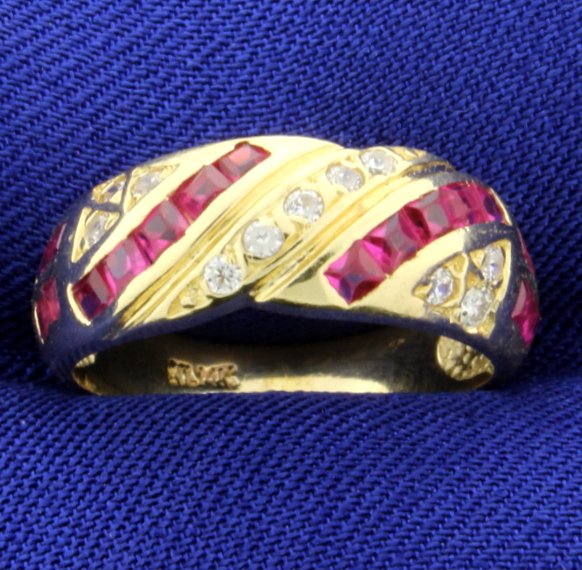 Ruby & Diamonds Set in 14K Yellow Gold Band: Channel 1/2 carat. There is 1/5 ct. of diamonds and 18-square cut rubies, total ruby weight .30 ct. Size 6 1/2. 3.6g