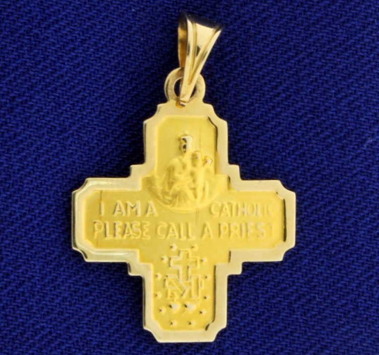 Catholic Cross Pendant: In 14K yellow gold, It is inscribed with Virgin Mary, Jesus, and " I am a Catholic. Please call a priest" on back. The cross is 1 inch long. 1.0g