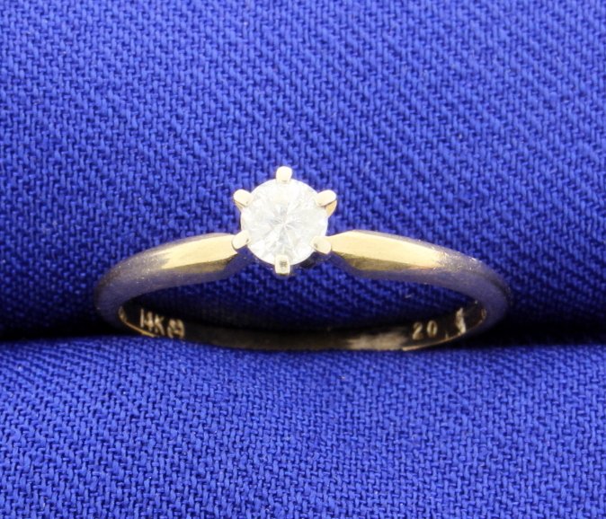 Diamond 1/5 carat 14k Solitaire Ladies Ring: The brilliant cut diamond center is I2 and H color. Size 6. 1.4g