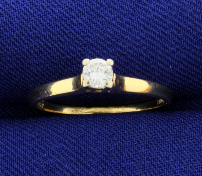 Diamond 1/5 Carat 18k Solitaire Ring: The center is a brilliant cut 0.20 carat diamond clarity VS2, color H. Size 6. 2.0g