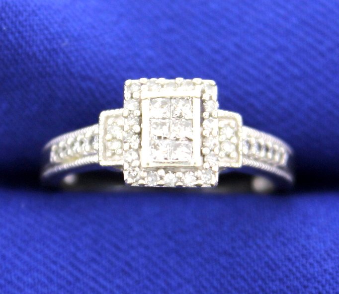 1/2 ct Diamond Ring: Ring contains 38 diamonds for a really big look. Approximately 1/2 ct total weight. Diamonds are G color, SI clarity. 10k gold. Size 7. 3.6g.