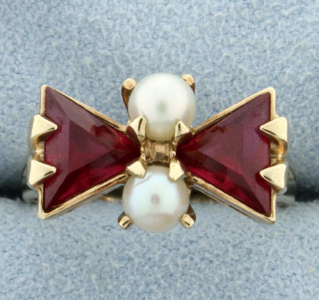 Lab Ruby & Pearl Ring: In 10K yellow gold, there is two 6.5mm trillion cut rubies and two 4.5mm pearls. Size 7 1/2 4.3g