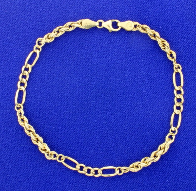 Figaro & Rope Chain Bracelet: In 10K yellow gold, it is 8 1/4 inches long and 4mm wide. With lobster clasp. 2.4g