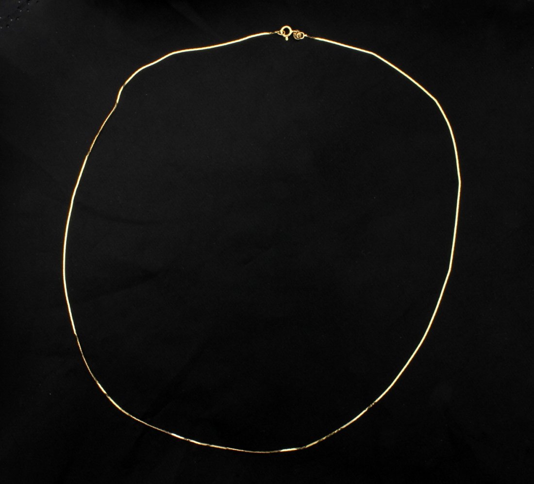 Italian Made 19 3/4 Inch Cobra Chain: In 14K yellow gold, the chain is .75mm thick. 1.2g