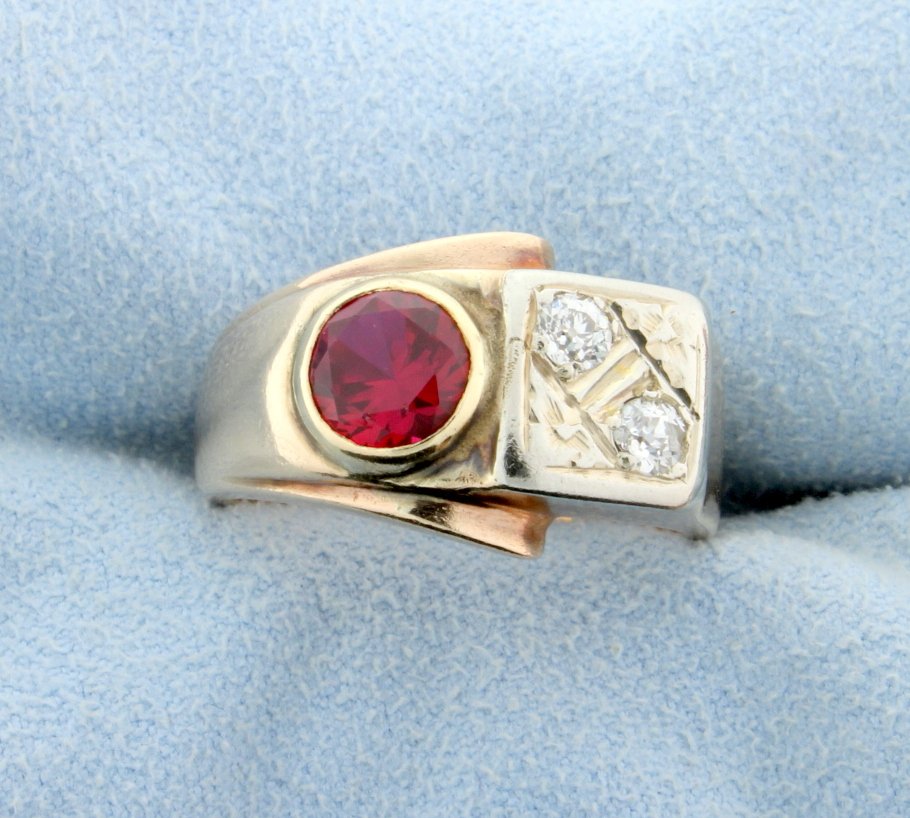 Antique Mine Cut Diamond and Ruby Ring: In 14K yellow gold this ring contains two .15ct mine cut diamond that are SI clarity/G color. One diamond has extremely small cleavage or natural that can only be seen with loop or microscope. It also