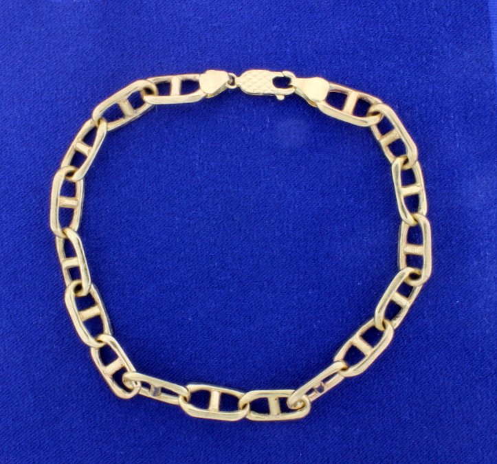 Men's Anchor Chain Heavy Bracelet: This bracelet is 14K yellow gold and is 9 1/2 inches long, 8mm thick, and has a lobster clasp. 25.2