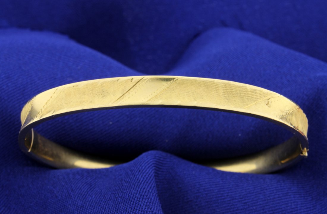 14k Bangle Bracelet Engraved & Hinged!: The bracelet is almost 1/4" in thickness and 2-1/4" inside diameter and opens for easy on! 7.0g