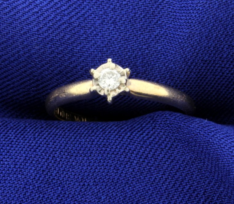 Diamond Solitaire Ring: The ring is 10K yellow & white gold and contains a .1ct diamond SI clarity/G color. The ring is a size 7. 1.8g