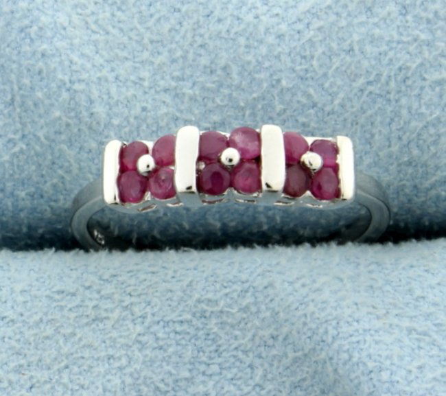 Ruby Ring in Platinum over Sterling Silver: Contains 2/3 ct TW of Genuine Rubies set in sterling silver over platinum. Size 7.5. 2.0g.