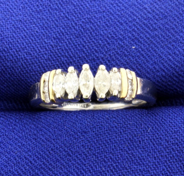 14k White & Yellow Diamond Ring: There are 5 marquise approx. .38ct TW, with approx.. SI2-I2 clarity and J-K color. There are 6 brilliant cut diamonds for a total of 0.12cts, clarity I1 and color J-K. Size 7. 3.9g