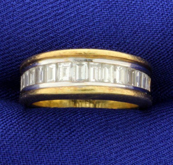 18k 1.5ct TW Diamond Band Ring: In 18K yellow gold this ring contains fourteen very high quality emerald cut diamonds, for a total of 1.5cts. The diamonds are VS clarity/ F color. Size 5 1/2 8.2g