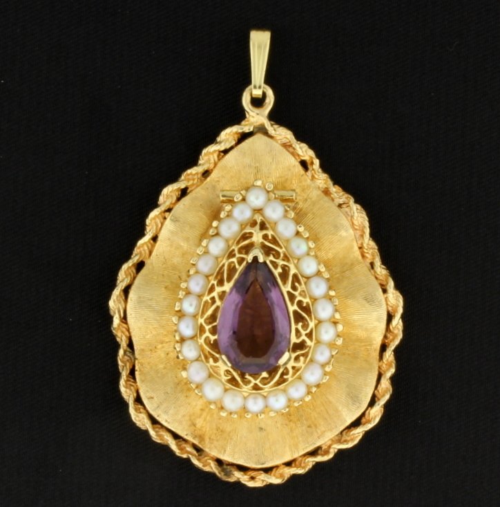Vintage Amethyst 14K Locket: Vintage 14K Locket with Amethyst Pear Shape Center Surrounded by Seed Pearls. The amethyst measures 13mm x 8mm approx. The locket opens from bottom of pearls and hinged! Great old locket. Condition Ex