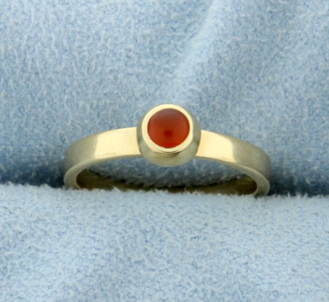 Spessarite Garnet Ring: In 14K yellow gold there is a 3.5mm spessarite garnet gemstone with great orange color. Size 4 1/2 2.2g